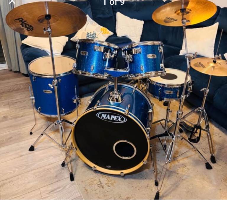Mapex full drum kit. Remo heads, Sabian & Paiste cymbal set. Bass, snare & toms. Cowbell.