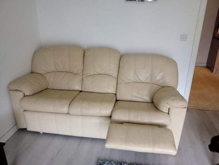 Creme leather reclining sofa and arm chairs.