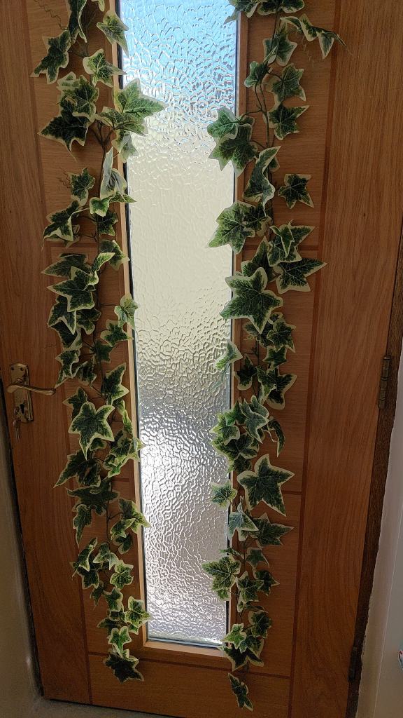 Ivy garland, lilly, roses, small blue flowers, ivory flowers in wooden basket. £5