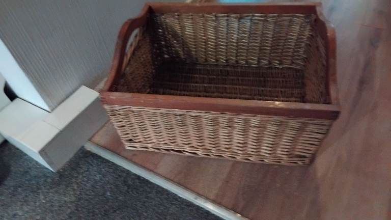 Sturdy wicker basket with wooden handles 22 in x 17 in  