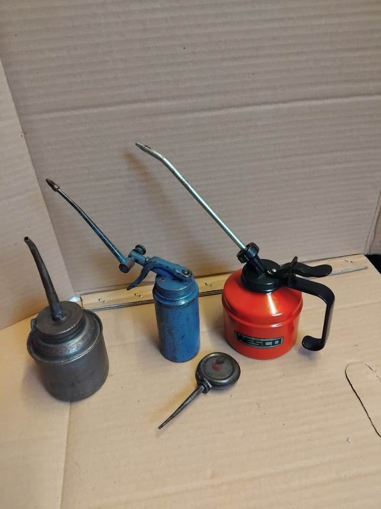 2 Wescot oil cans + plus 2 Others 