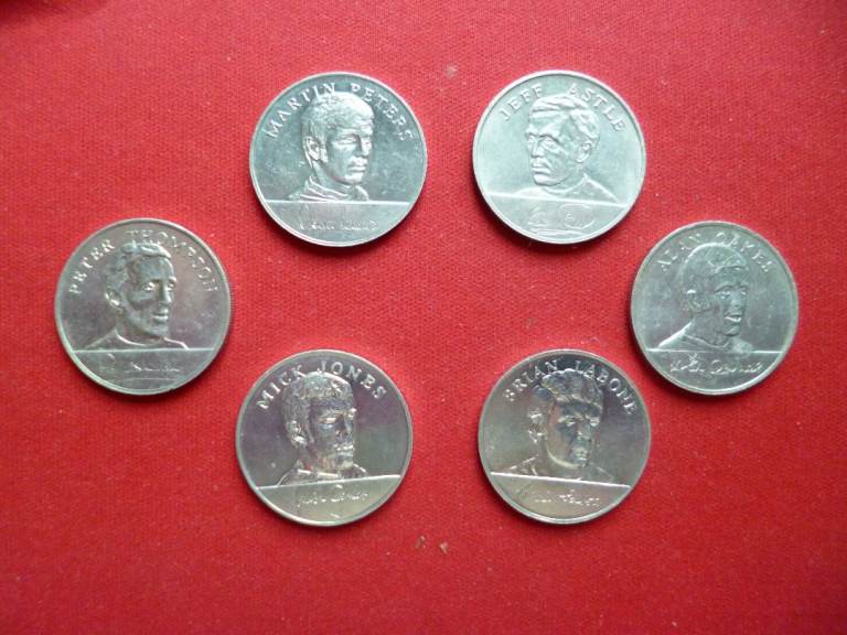 Six foot ball players coins and six others