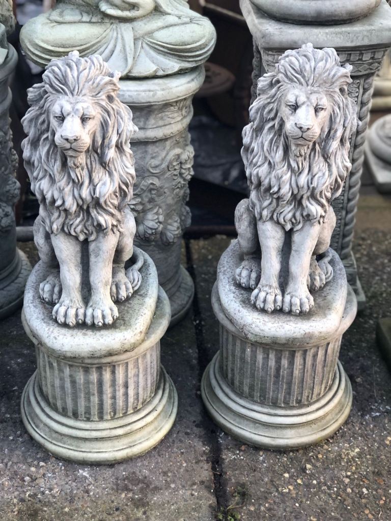 Pair of Lions on Small plinths 