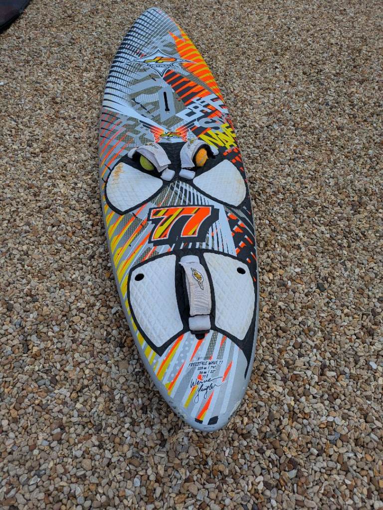 Windsurfing board, sails, masts, boom, mastfeet and fins.