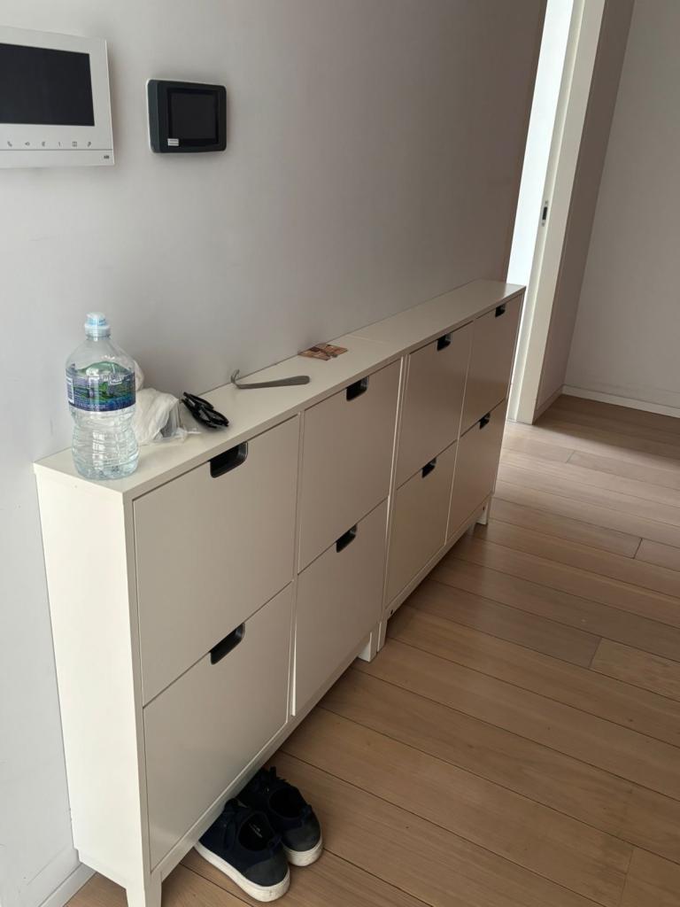 White shoe rack with shelf