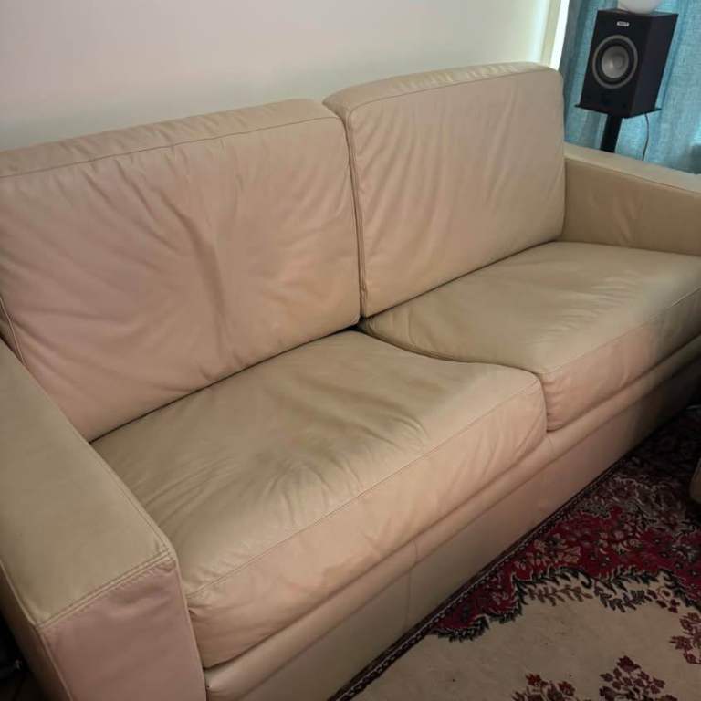 Cream faux leather sofa (pull out sofa bed)