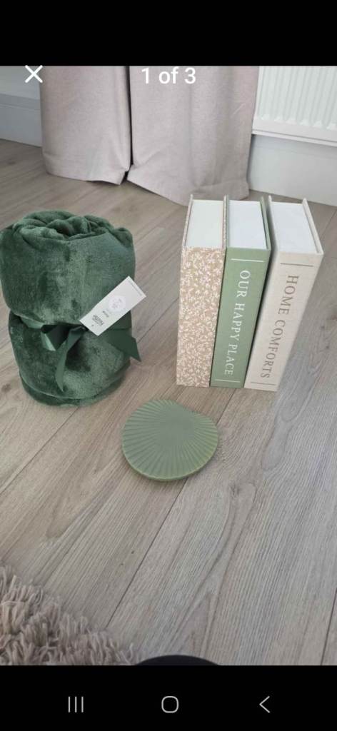 Green throw and decorative storage boxes 