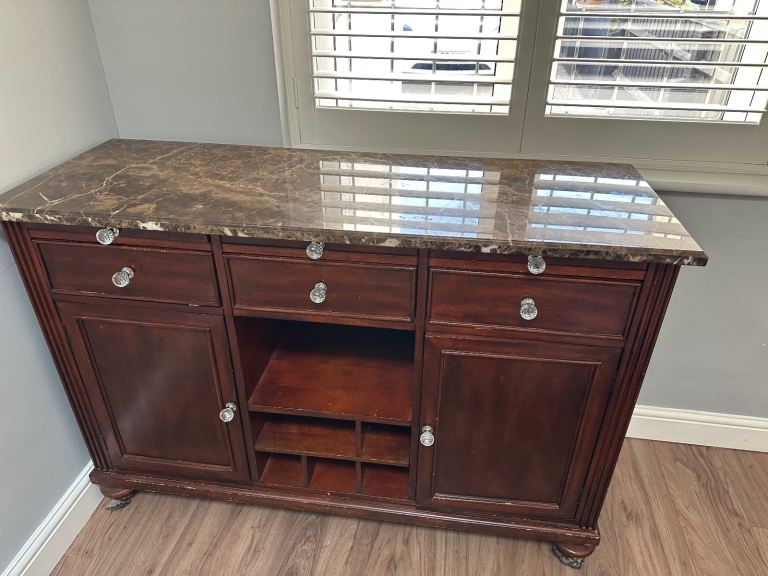 Sideboard with brown marble top as shown in the picture 