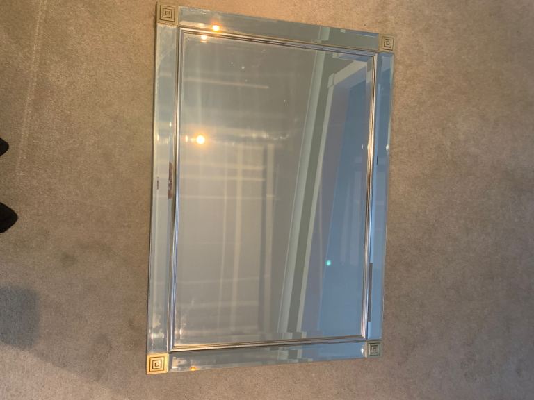 Large frameless mirror with corner detailing