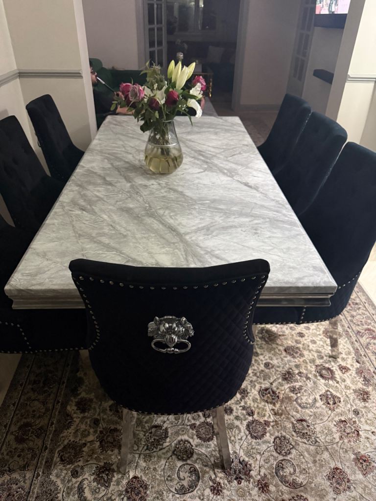 Stylish Grey Marble Dining Table with Black Velvet Chairs