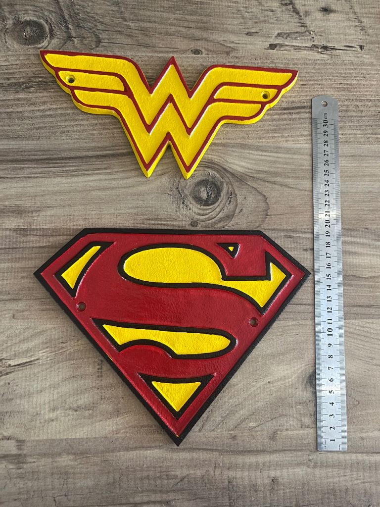 Superman and wonder woman cast metal signs (£25 each)