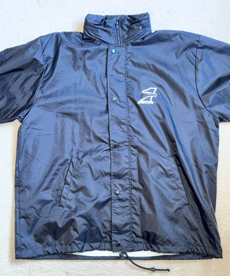 Black, light weight jacket with white inner lining