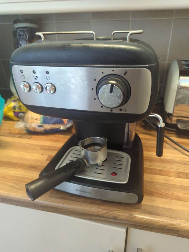 Cook works coffee machine