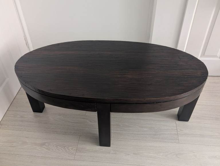 Solid oval coffee table