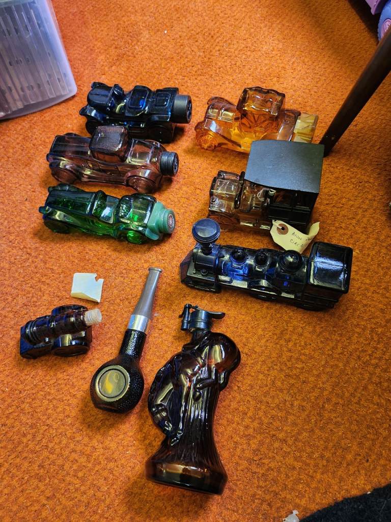 Vintage avon scent bottles ordaments.  Cars ,horse,cannon , pipe and train . With aftershave.  