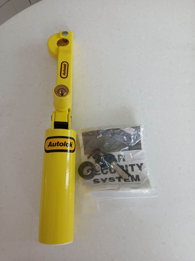 Autolok handbrake and gear lever lock