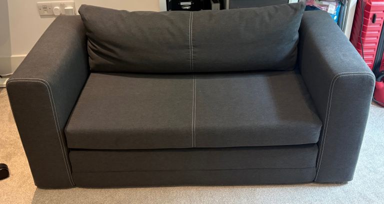 Grey 2-seater sofa bed (Askeby), almost as new