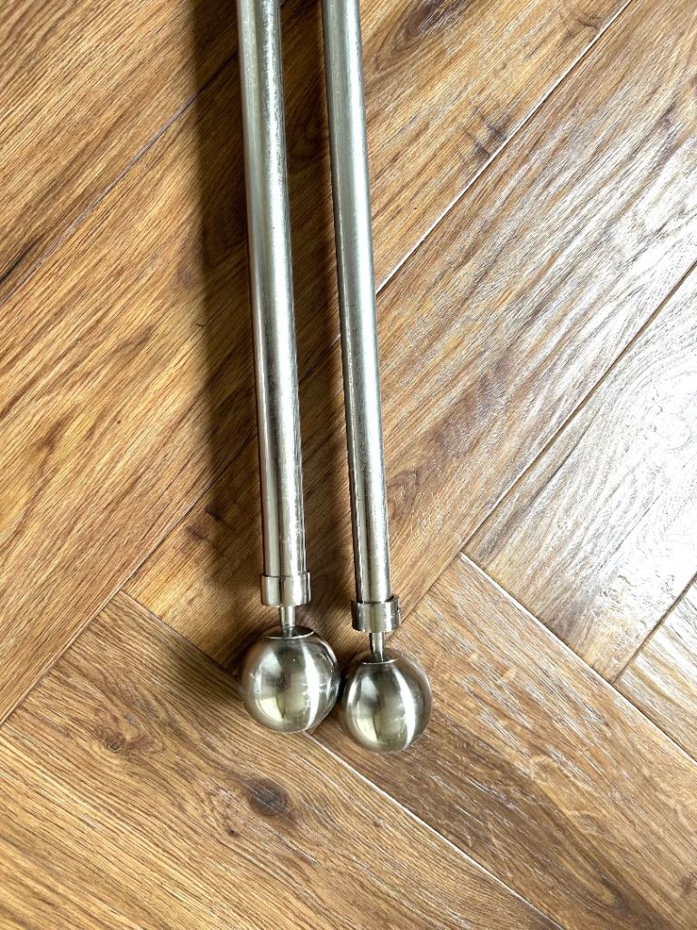 Dunelm extendable brushed chrome curtain rail with matching metal tie bavjs