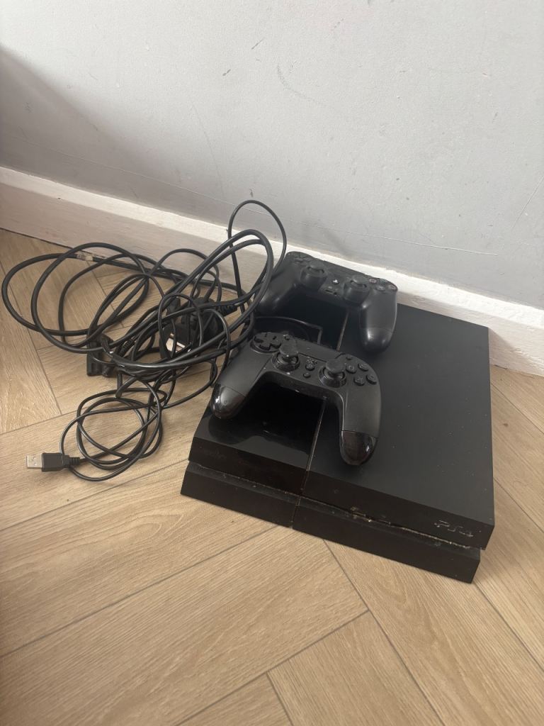 Sony PlayStation 4 Console with Two Controllers – Good Condition