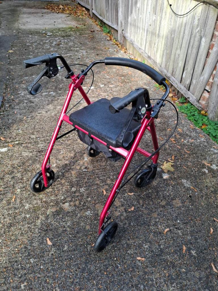 NRS Healthcare 4-Wheel Rollator Walker with Seat, Bag & Brakes – Red