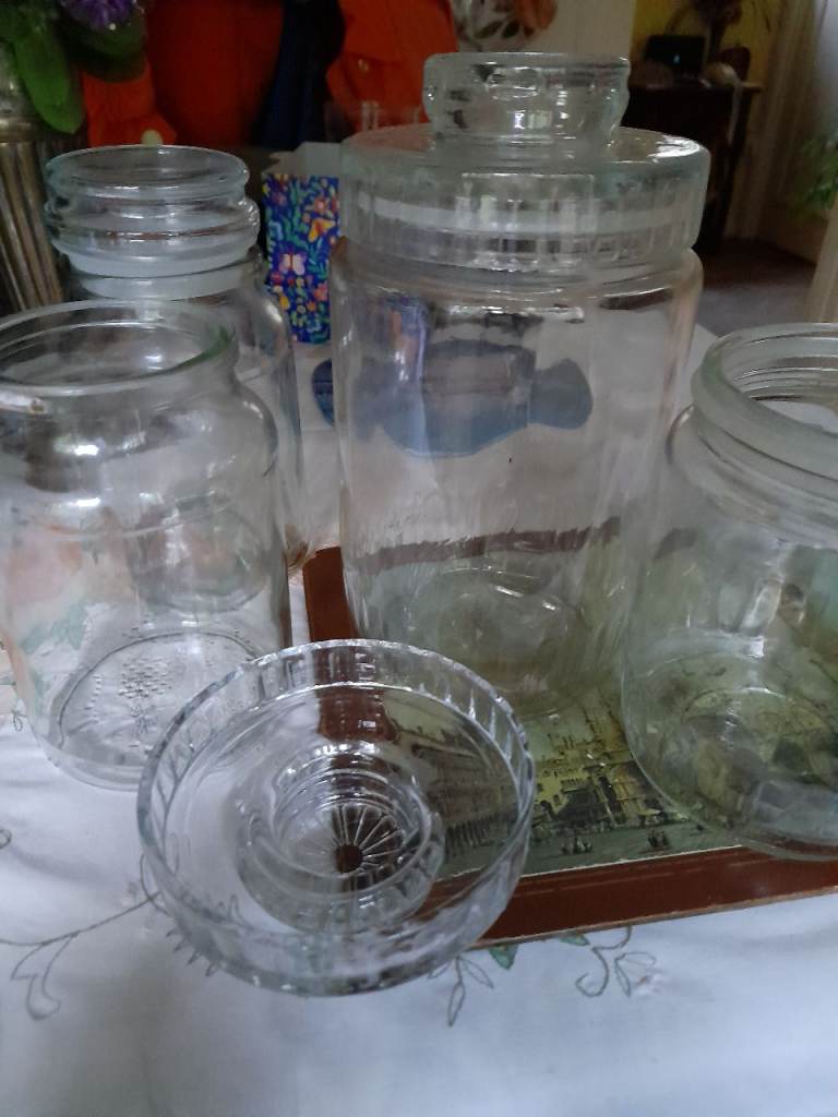 Collection of 4 glass storage jars 