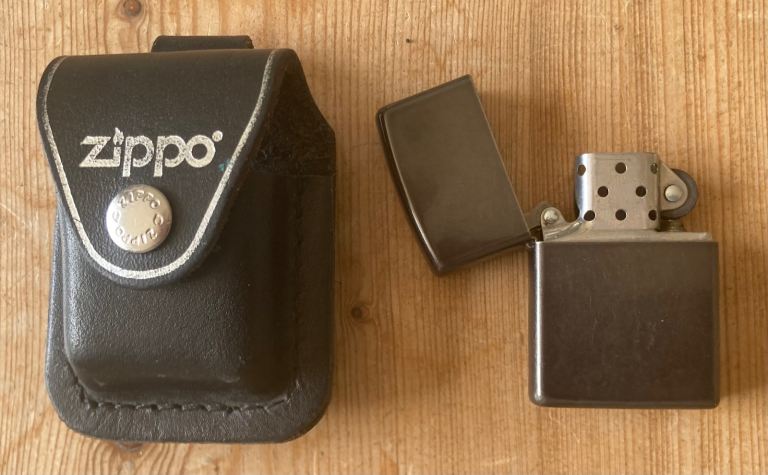 Zippo Lighter with Black Leather Pouch – Good Condition