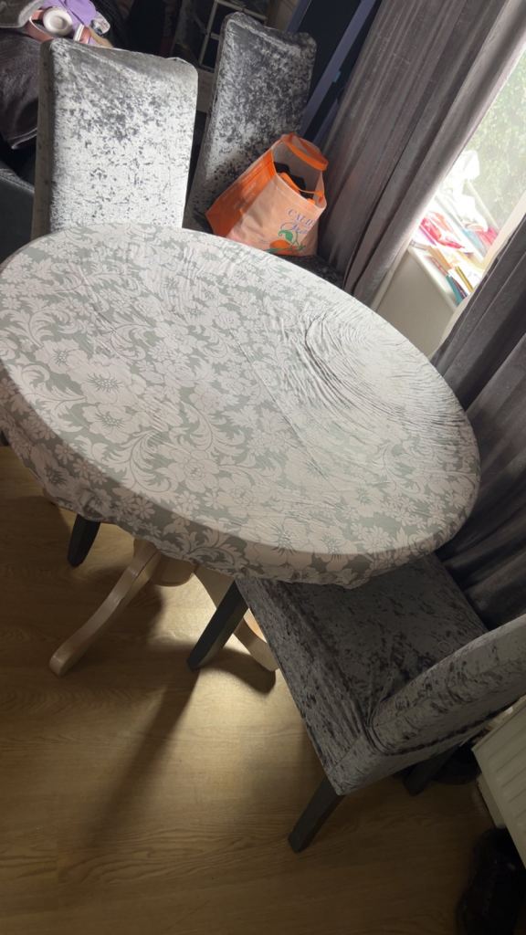 Wooden dining table and 3 chairs with covers 