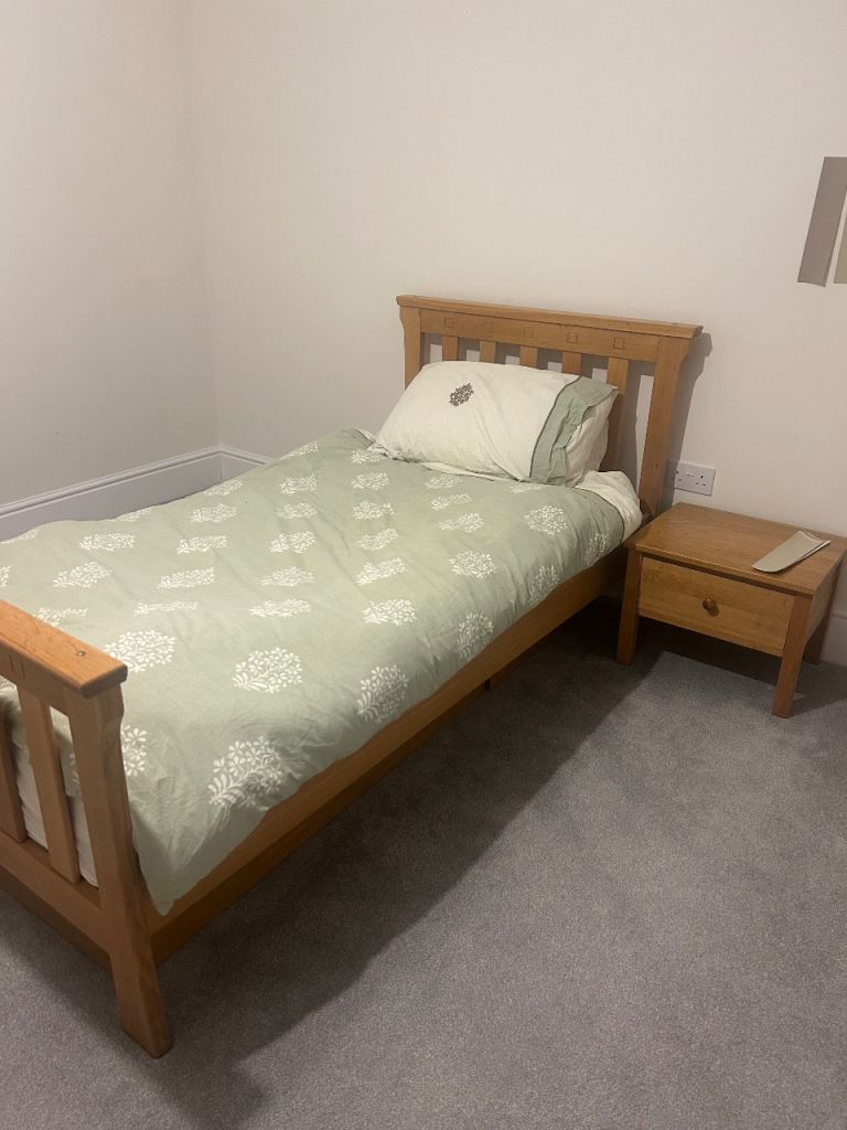 Single child’s solid oak bed with storage and side table