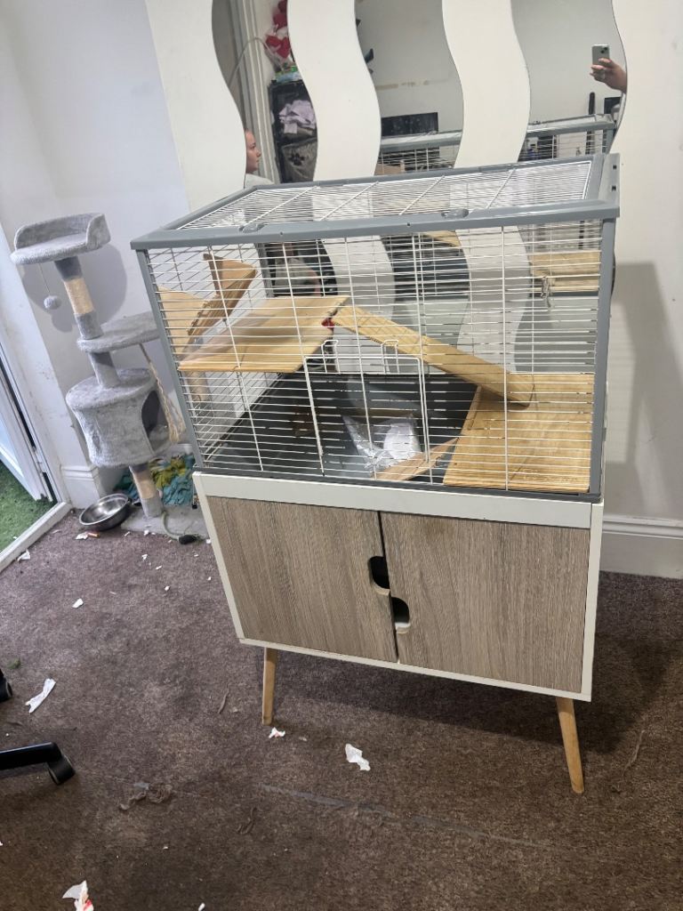 Large pet cage with stand and cupboard ( can deliver if close )
