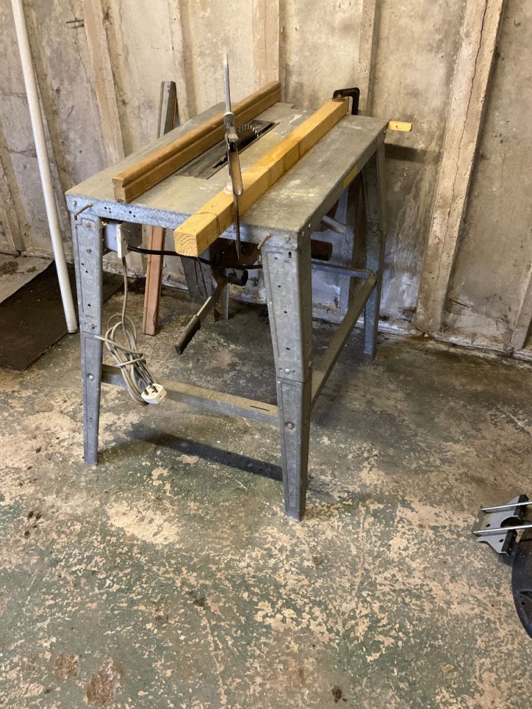saw bench,anvil,drill press.