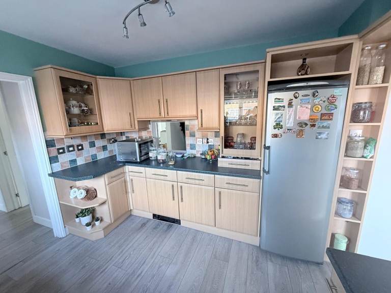 Kitchen cabinets with doors, appliances and worktop