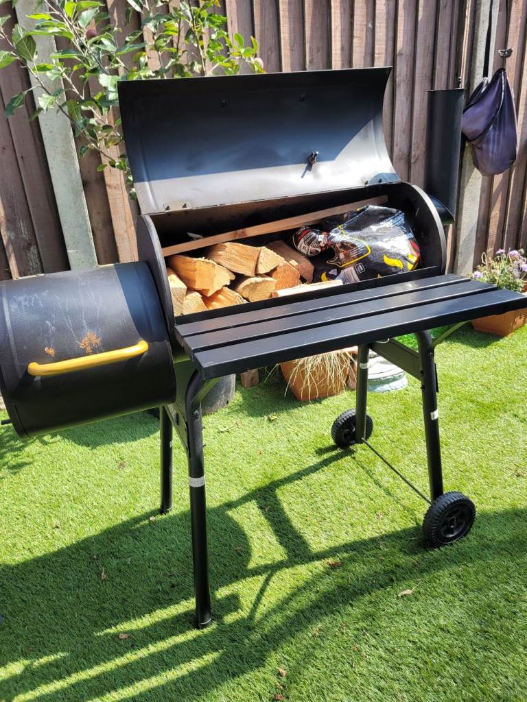 large charcoal barbeque with smoker 