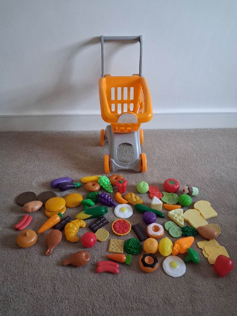Toy shopping trolley and food