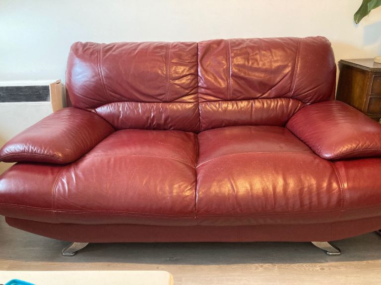 2 burgundy faux leather sofas