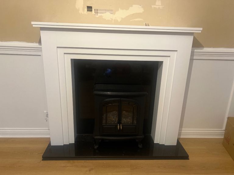 Fire place frame with stove and stone base