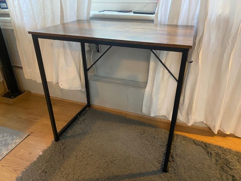 Small wooden desk with metal frame and headphone hook