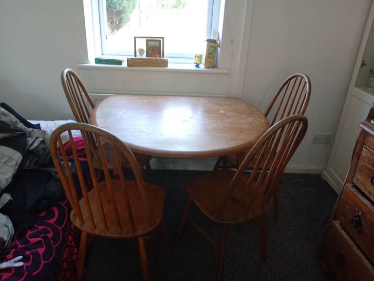Ercol Oak round table and 4 chairs 