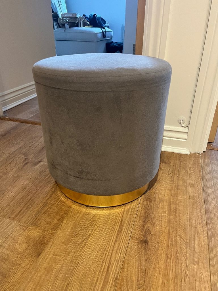 Grey velvet pouffe stool with gold band