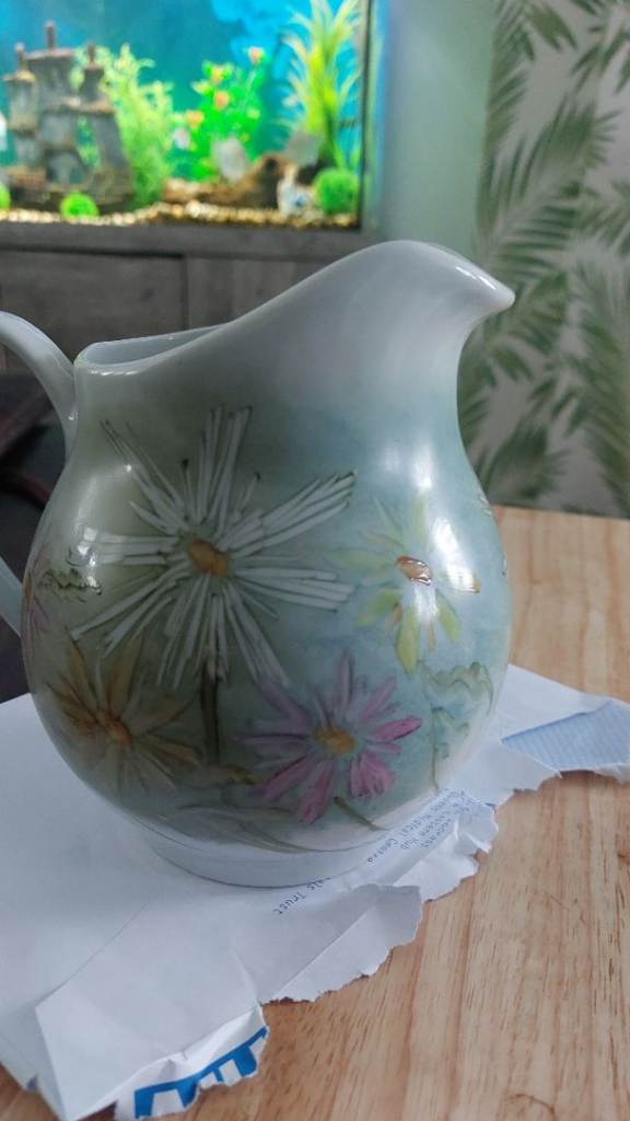 handcrafted studio art pottery featuring the maker's mark "Hand painted by Judy Wilson".