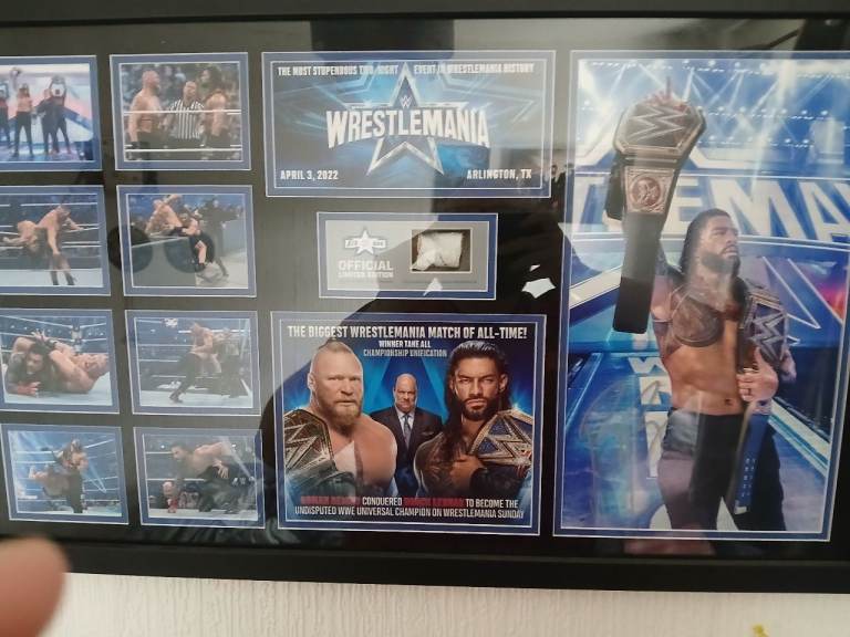 Wwe hand signed roman reigns picture with actual ring rope numbered to /500 in the world
