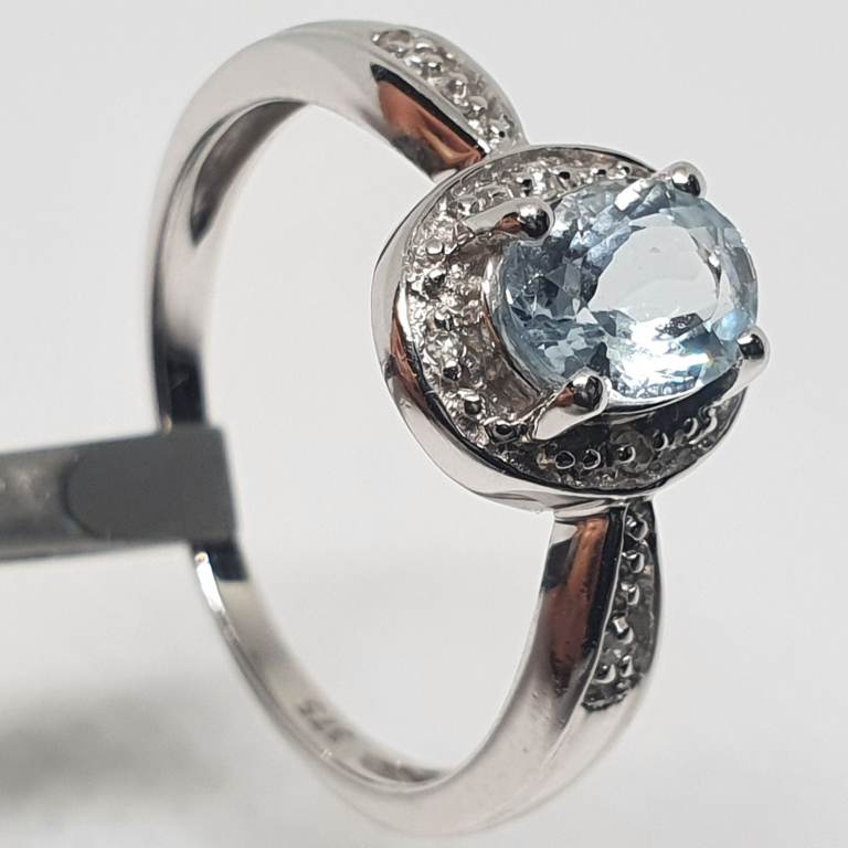 9ct wihte gold Aquamarine and diamond halo ring. Price Based on Today’s Gold Rate