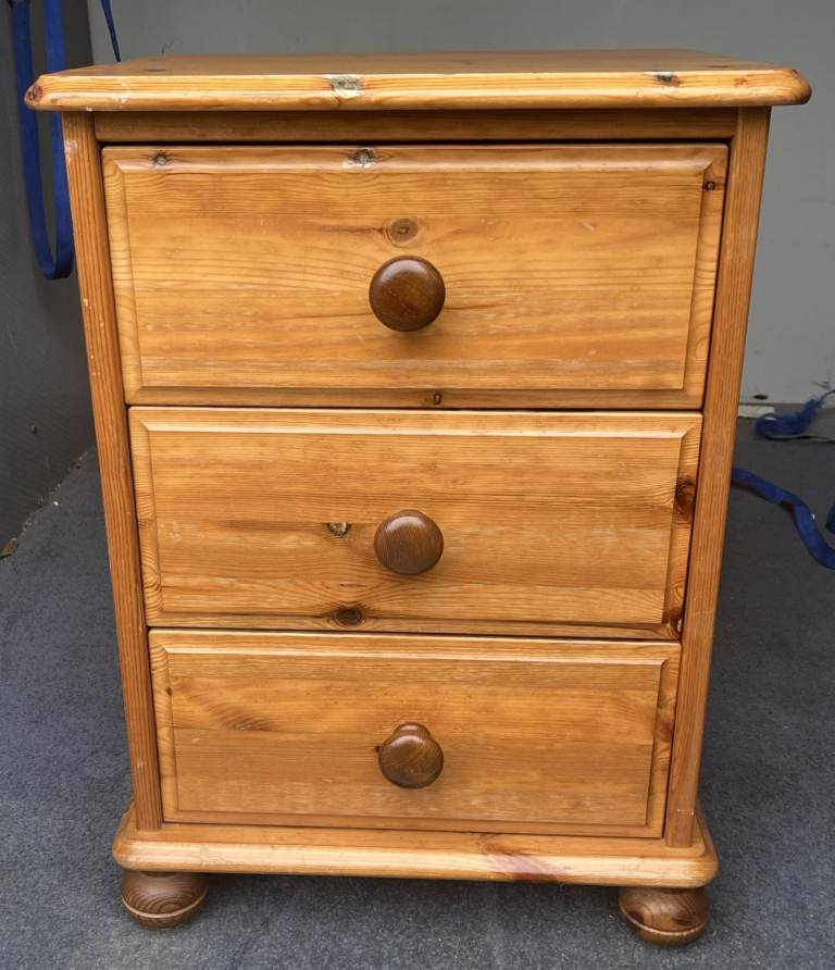 A SOLID PINE BEDSIDE CHEST