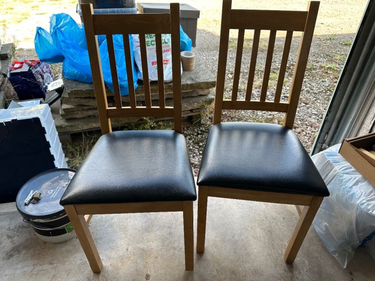 Two Wooden Dining Chairs with Black Seats – Good Condition