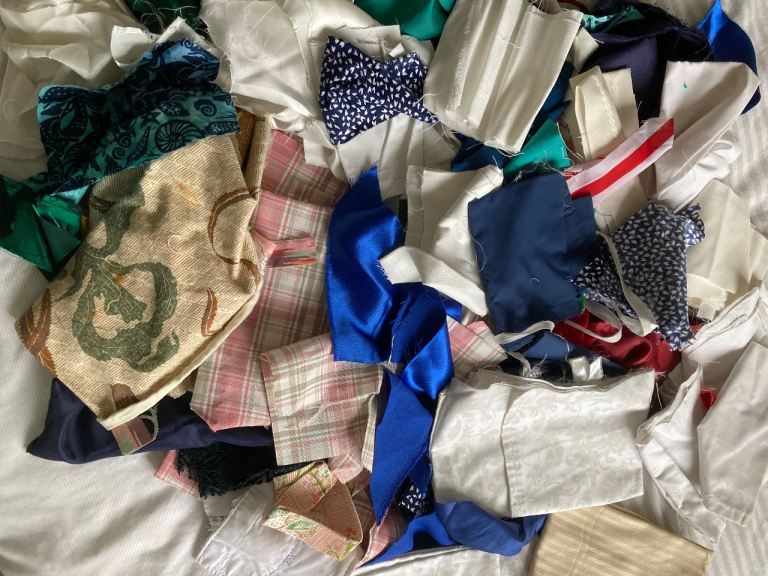 Bag of mixed fabric scraps- good for crafts/stuffing