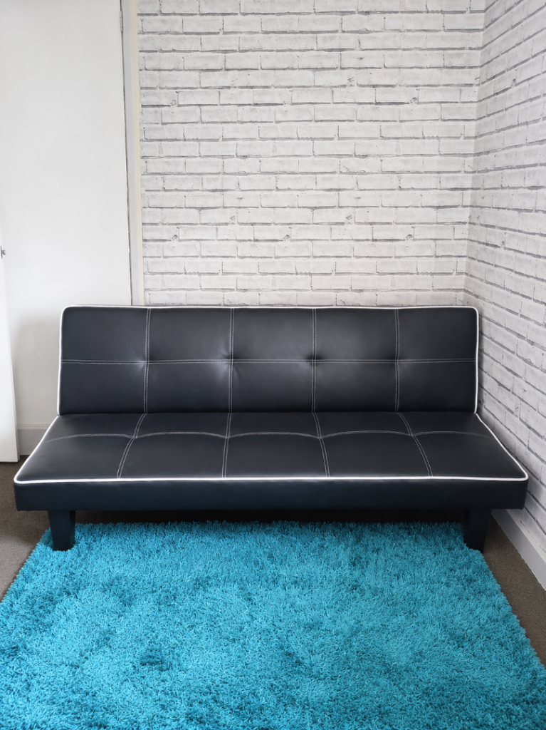 Black click-clack sofa bed 