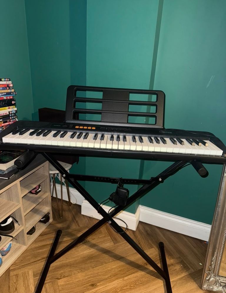 Casio Electric Keyboard with Stand – Good Condition