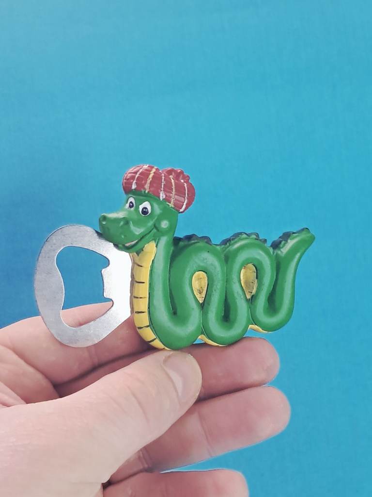 This is a Thistle Products Nessie Resin Bottle Opener Magnet..