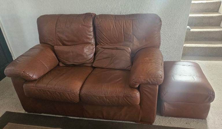 Two Brown leather 2 seater sofas with leather footstool