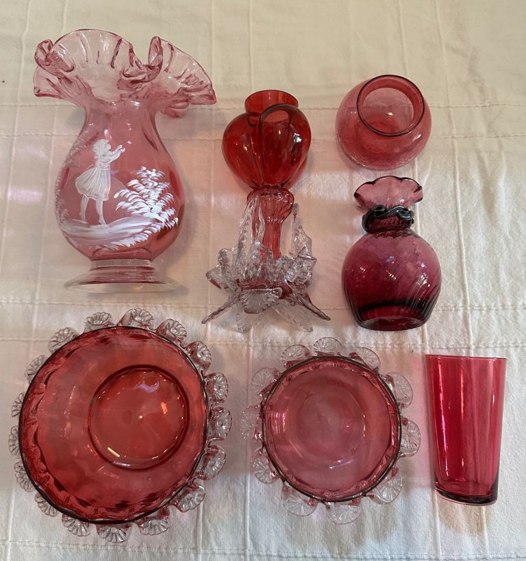 Selection of vintage cranberry glassware including Mary Gregory