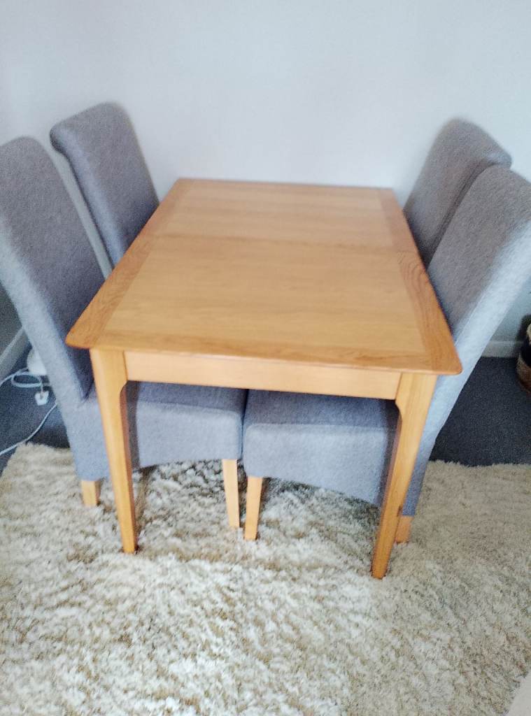 Light Oak dining table and chairs 